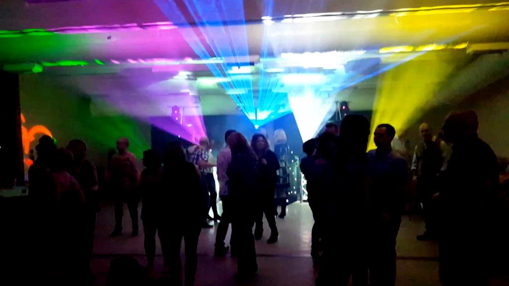 Purple, blue and yellow laser effects at mobile disco