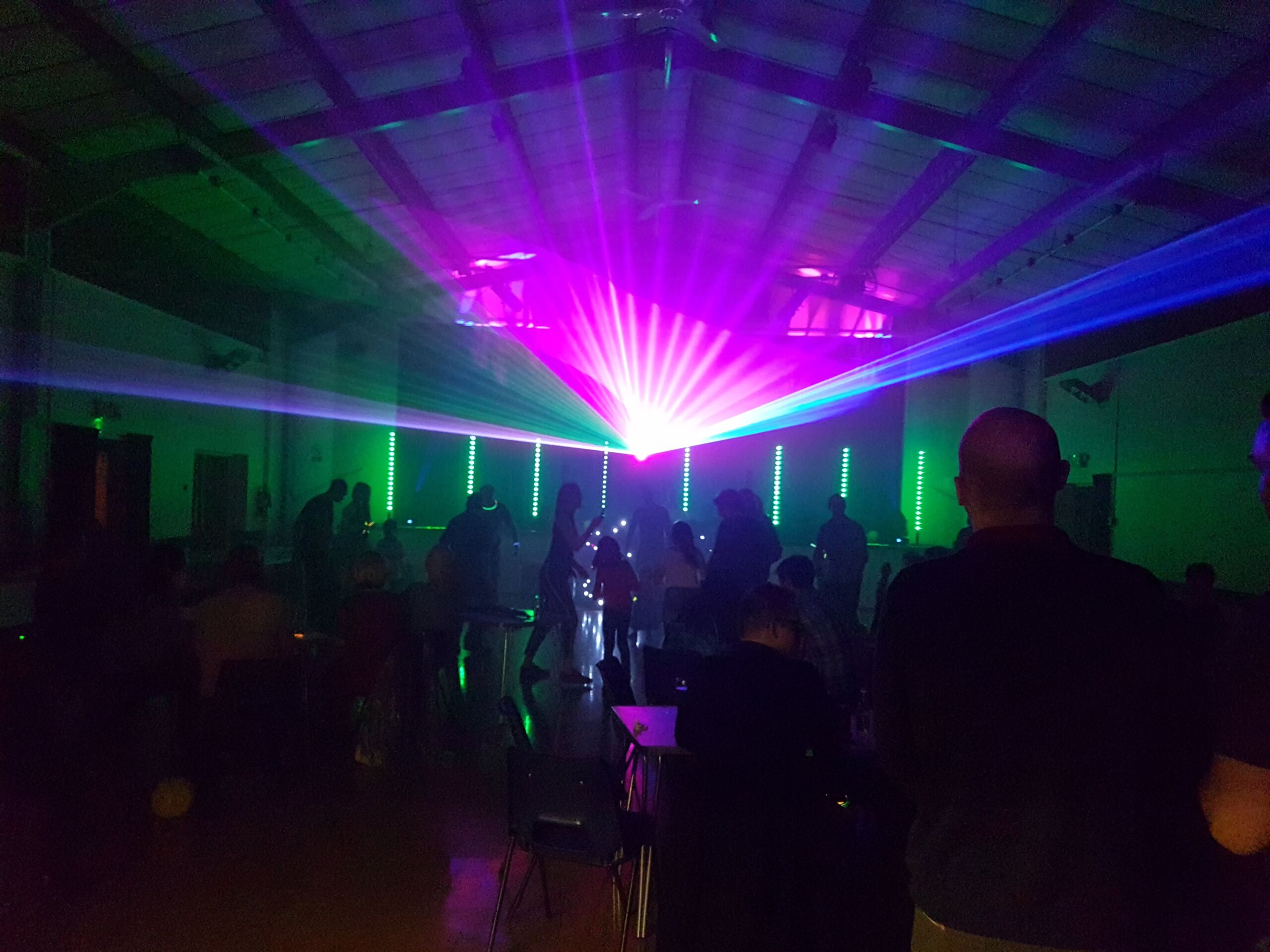 Pink and Blue laser lighting at a mobile disco