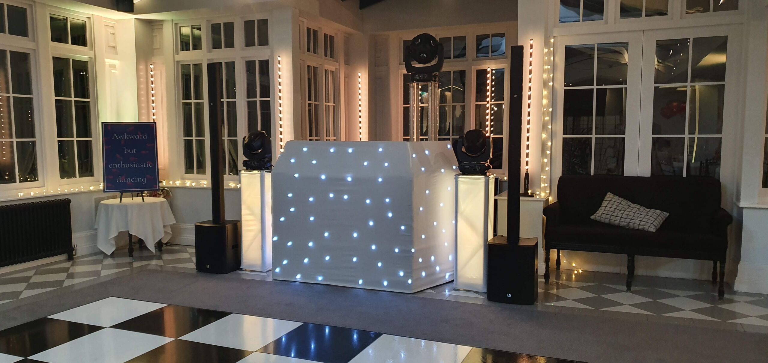 Wedding disco at Swynford Manor, Suffolk, Cambridgeshire with white starlit DJ booth